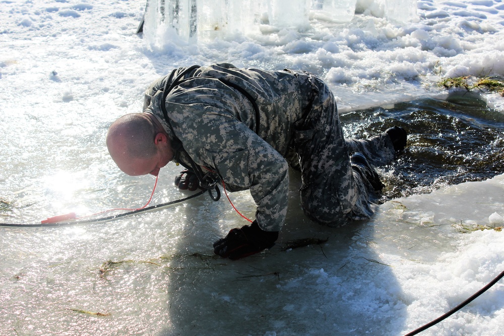 Students take plunge in icy water for Cold-Weather Operations Course 18-02 at Fort McCoy