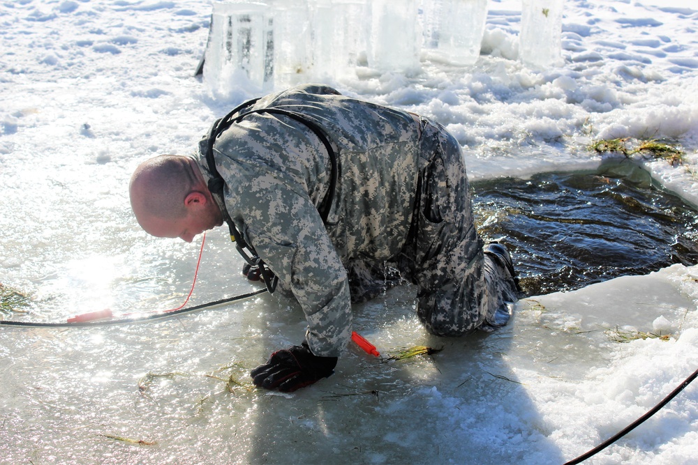 Students take plunge in icy water for Cold-Weather Operations Course 18-02 at Fort McCoy