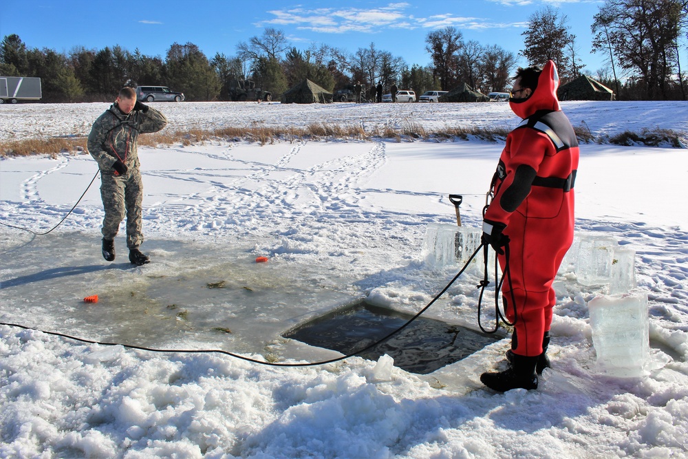 Students take plunge in icy water for Cold-Weather Operations Course 18-02 at Fort McCoy