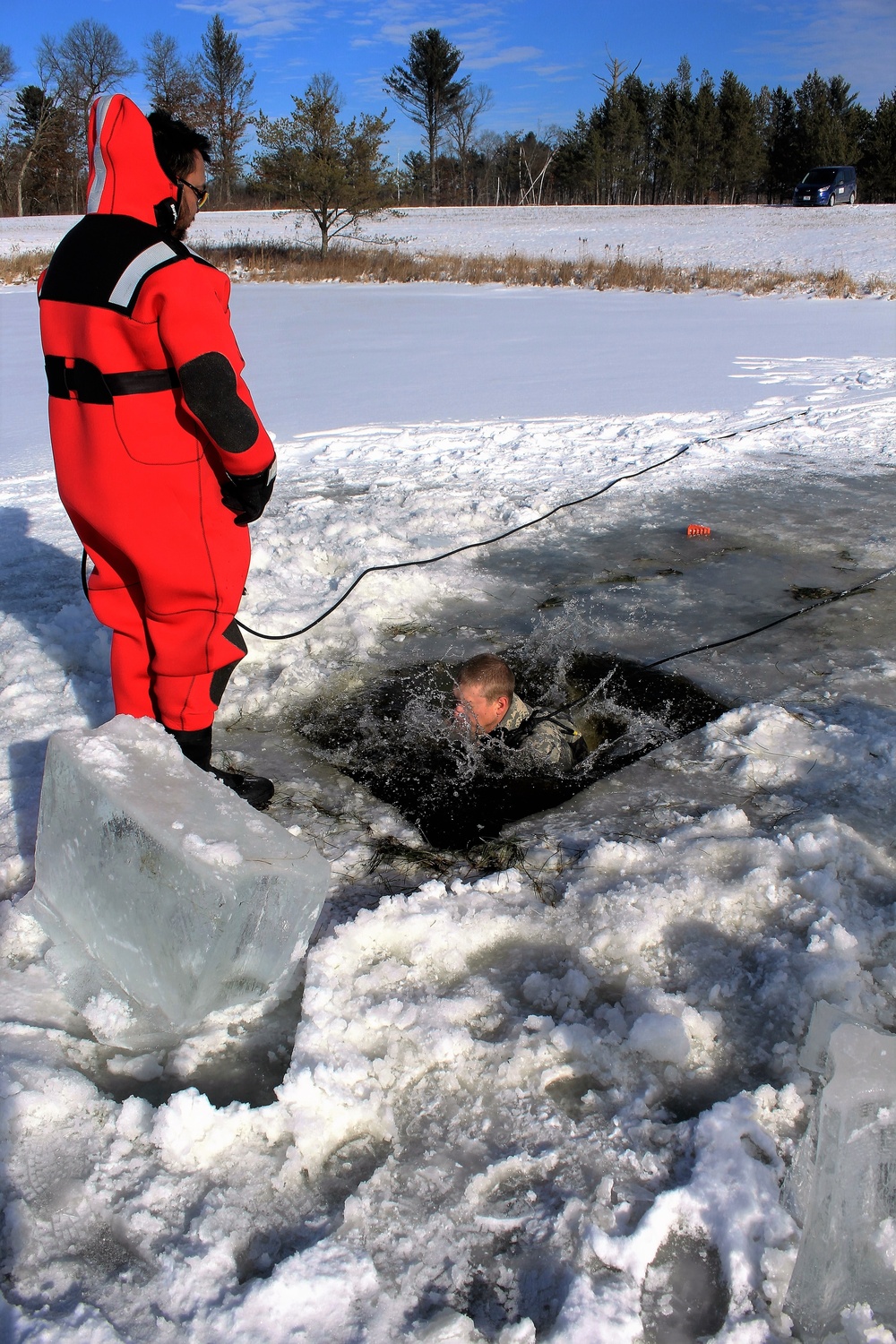 Students take plunge in icy water for Cold-Weather Operations Course 18-02 at Fort McCoy