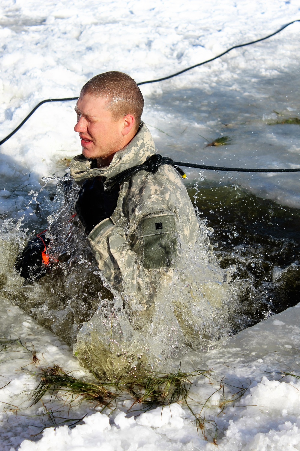 Students take plunge in icy water for Cold-Weather Operations Course 18-02 at Fort McCoy