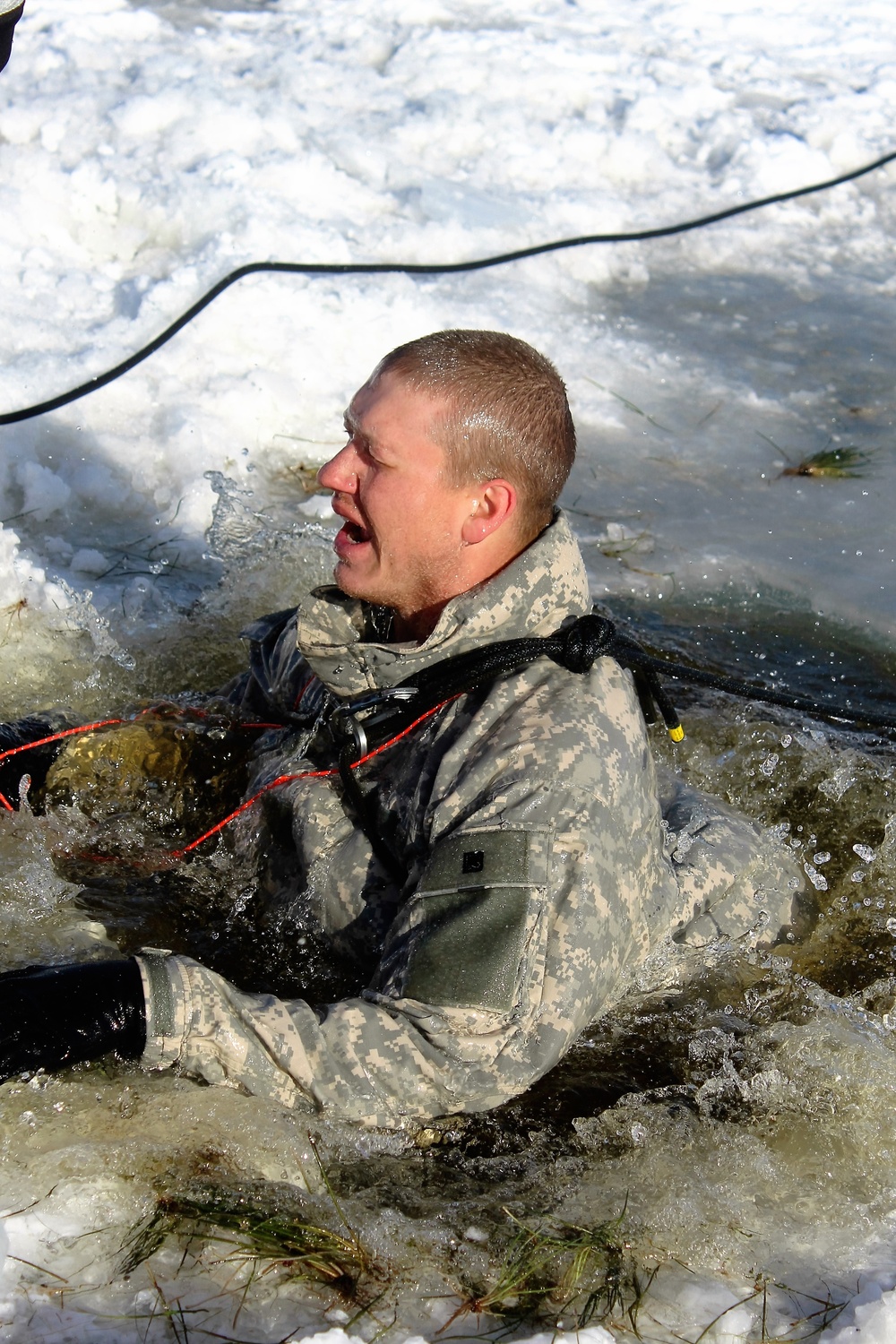 Students take plunge in icy water for Cold-Weather Operations Course 18-02 at Fort McCoy