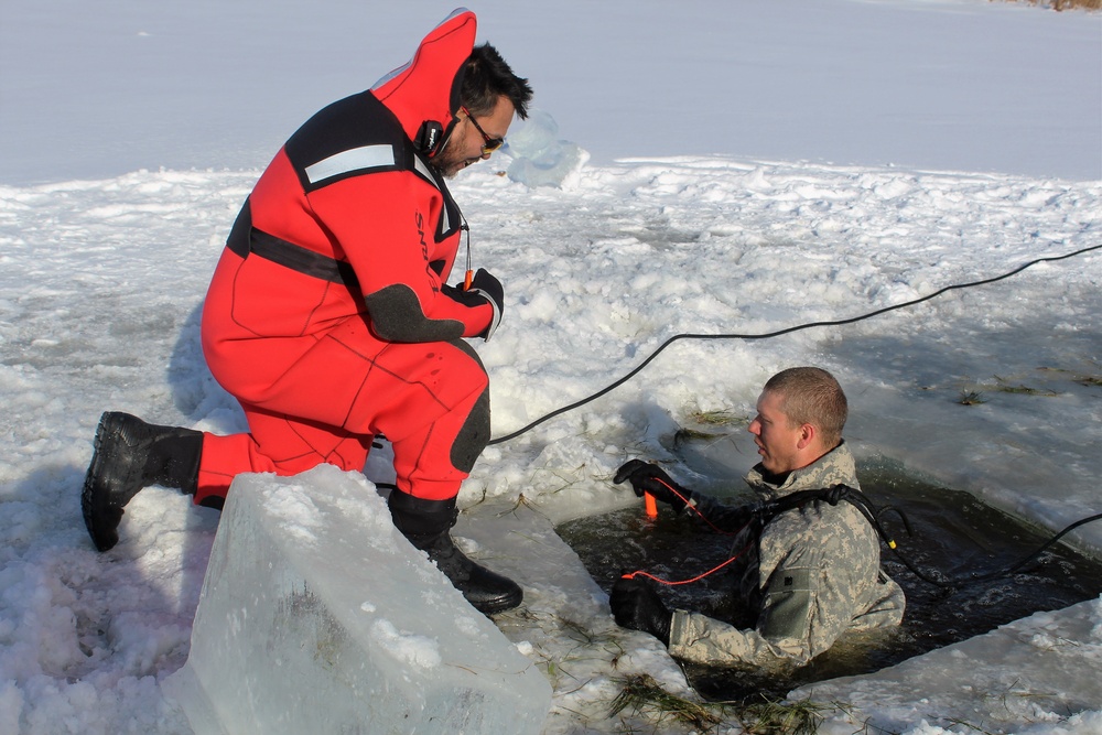 Students take plunge in icy water for Cold-Weather Operations Course 18-02 at Fort McCoy