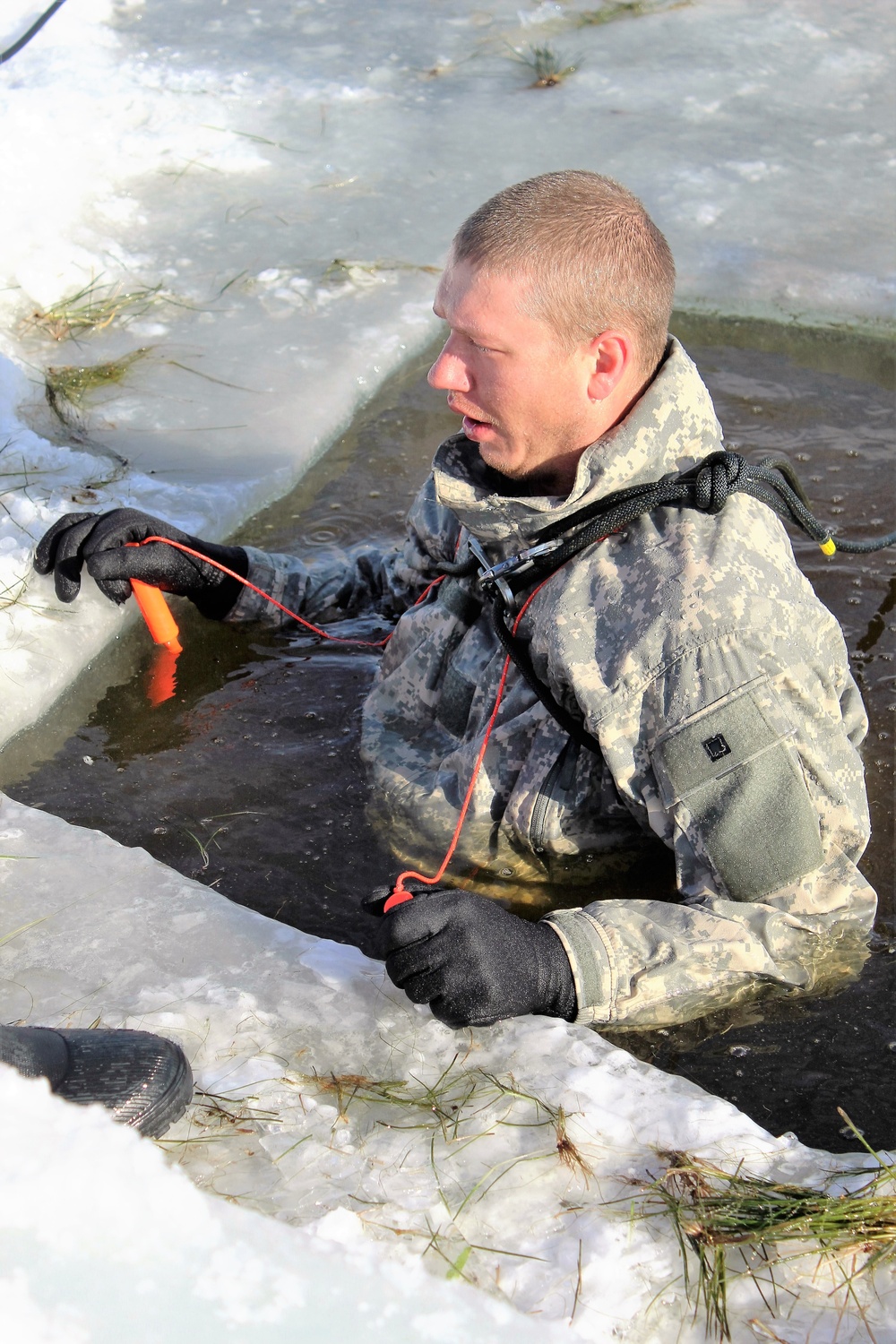 Students take plunge in icy water for Cold-Weather Operations Course 18-02 at Fort McCoy