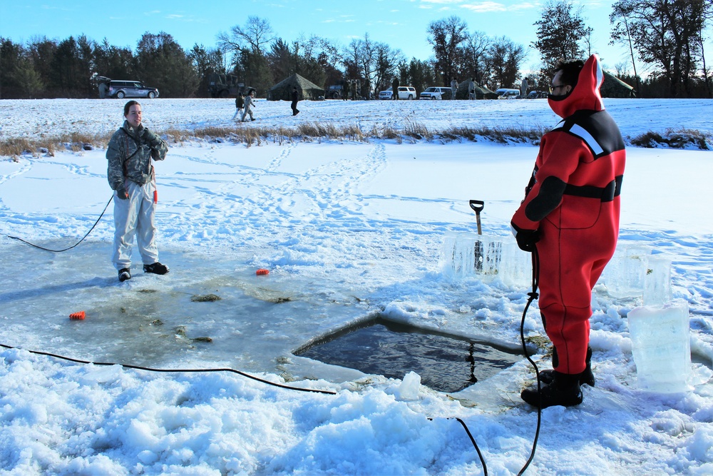 Students take plunge in icy water for Cold-Weather Operations Course 18-02 at Fort McCoy