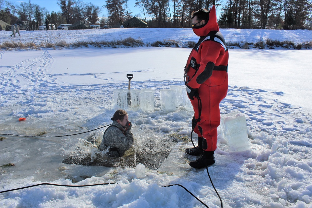 Students take plunge in icy water for Cold-Weather Operations Course 18-02 at Fort McCoy