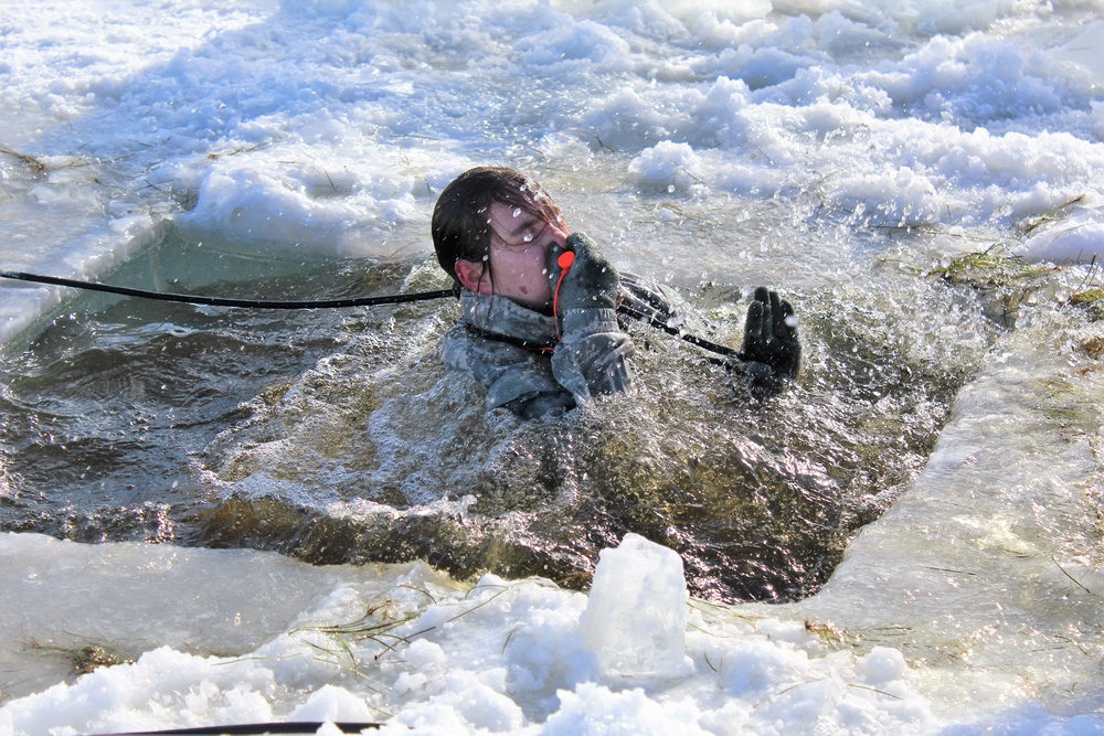 Students take plunge in icy water for Cold-Weather Operations Course 18-02 at Fort McCoy