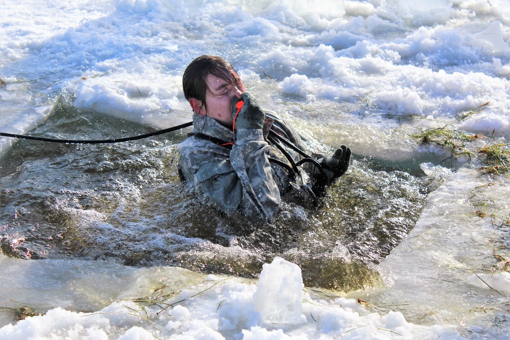 Students take plunge in icy water for Cold-Weather Operations Course 18-02 at Fort McCoy