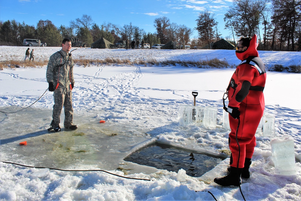 Students take plunge in icy water for Cold-Weather Operations Course 18-02 at Fort McCoy