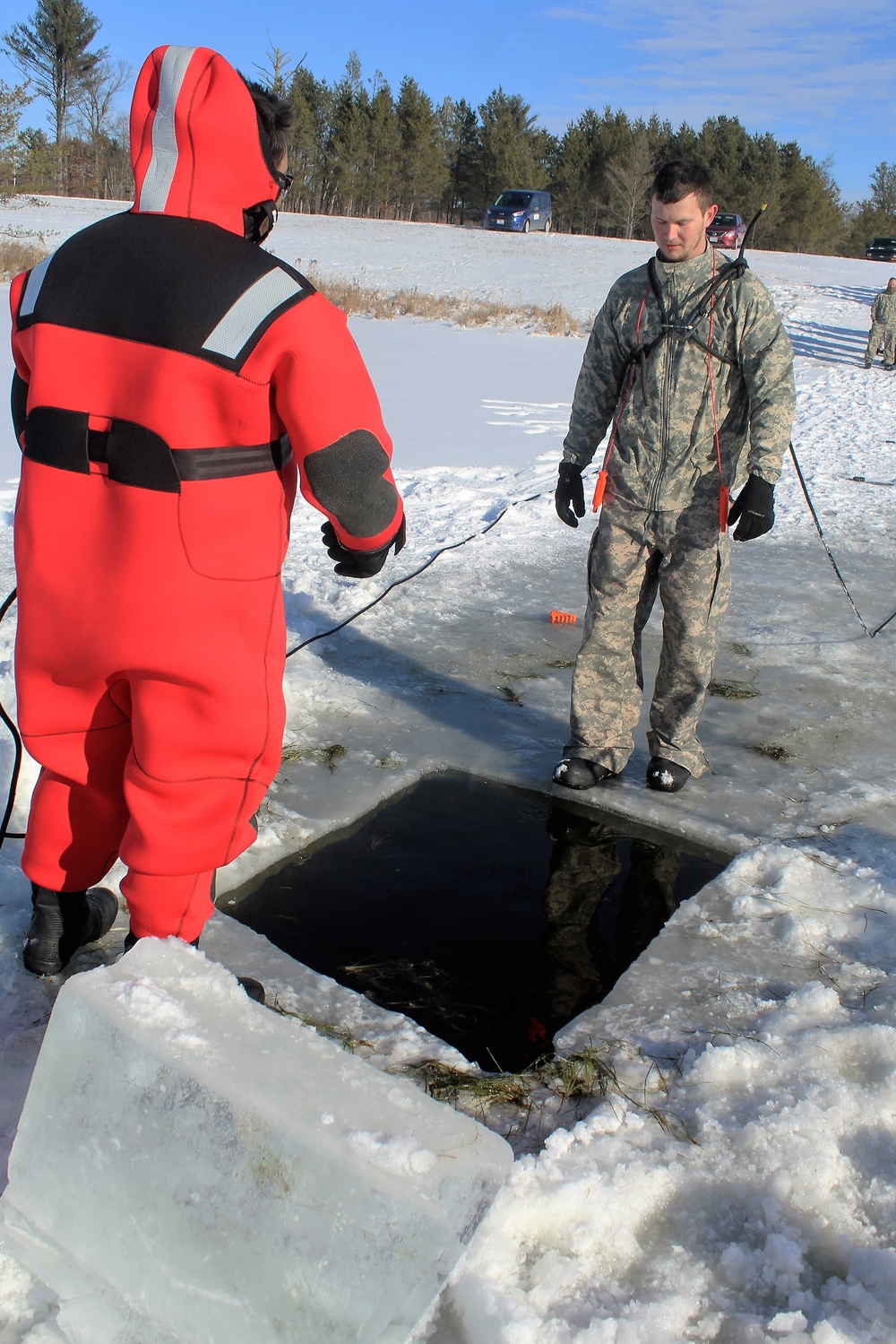 Students take plunge in icy water for Cold-Weather Operations Course 18-02 at Fort McCoy