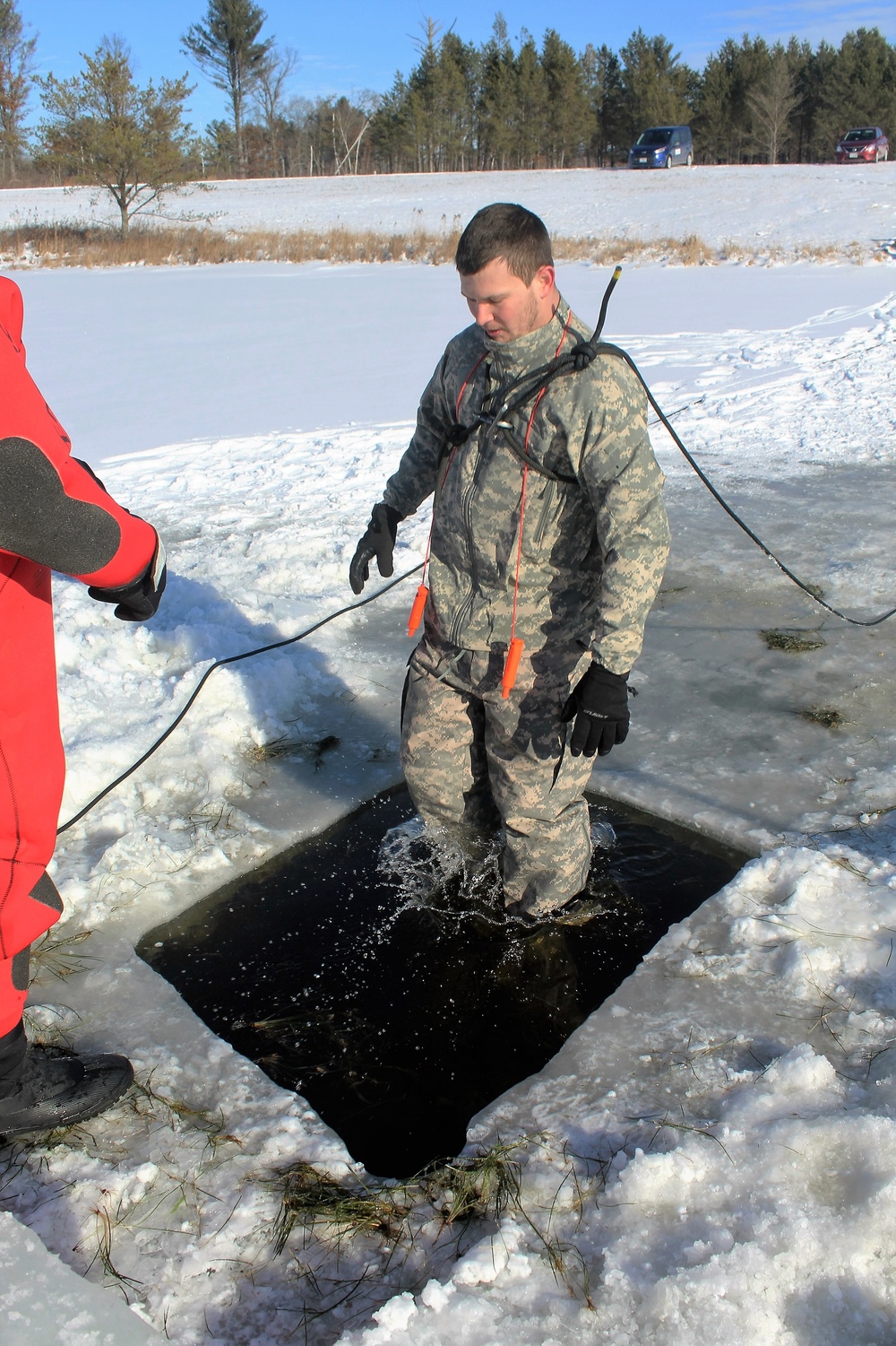 Students take plunge in icy water for Cold-Weather Operations Course 18-02 at Fort McCoy