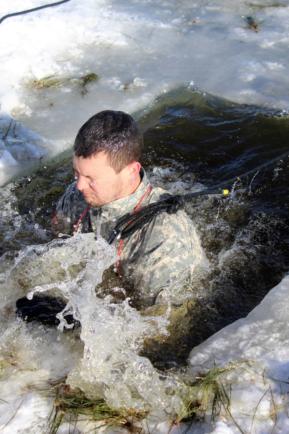 Students take plunge in icy water for Cold-Weather Operations Course 18-02 at Fort McCoy