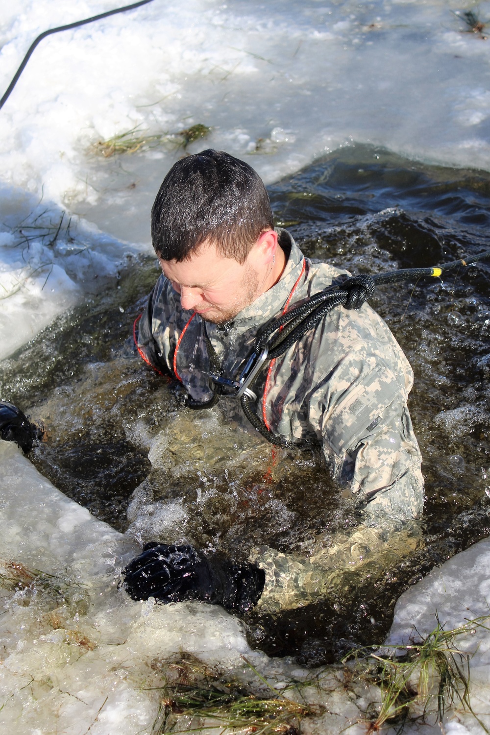 Students take plunge in icy water for Cold-Weather Operations Course 18-02 at Fort McCoy