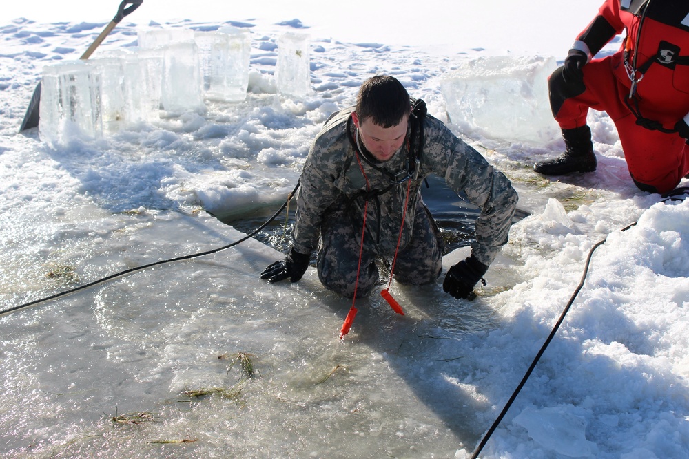 Students take plunge in icy water for Cold-Weather Operations Course 18-02 at Fort McCoy