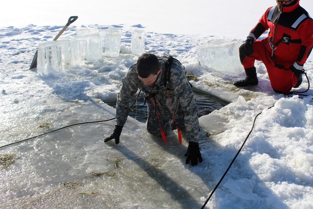 Students take plunge in icy water for Cold-Weather Operations Course 18-02 at Fort McCoy