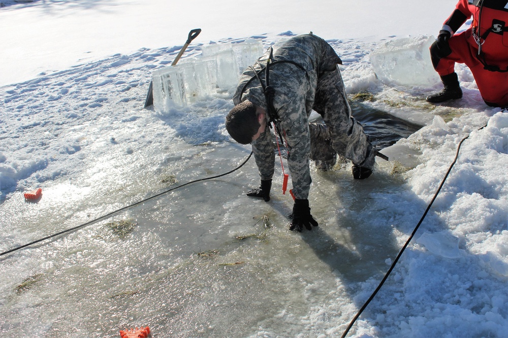 Students take plunge in icy water for Cold-Weather Operations Course 18-02 at Fort McCoy