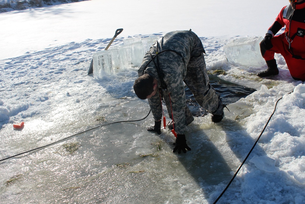 Students take plunge in icy water for Cold-Weather Operations Course 18-02 at Fort McCoy