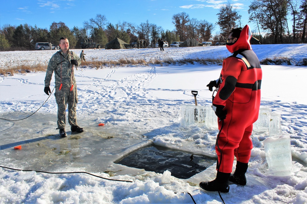 Students take plunge in icy water for Cold-Weather Operations Course 18-02 at Fort McCoy