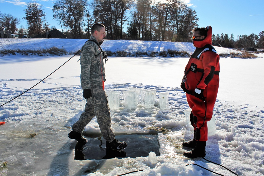 Students take plunge in icy water for Cold-Weather Operations Course 18-02 at Fort McCoy