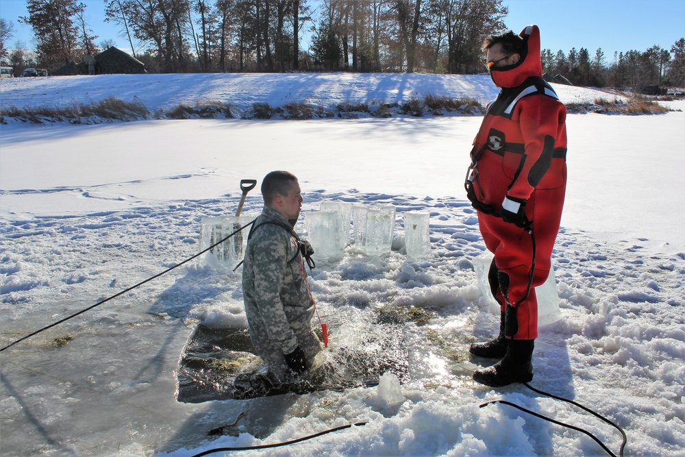 Students take plunge in icy water for Cold-Weather Operations Course 18-02 at Fort McCoy