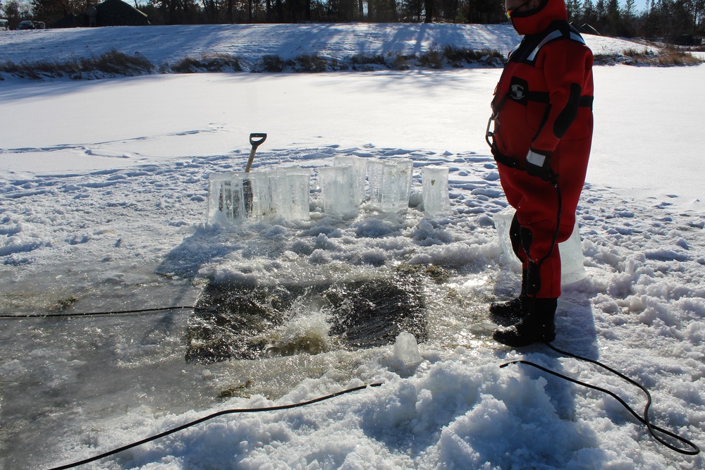 Students take plunge in icy water for Cold-Weather Operations Course 18-02 at Fort McCoy