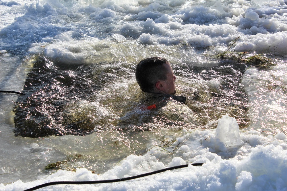 Students take plunge in icy water for Cold-Weather Operations Course 18-02 at Fort McCoy