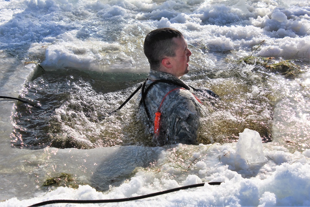 Students take plunge in icy water for Cold-Weather Operations Course 18-02 at Fort McCoy