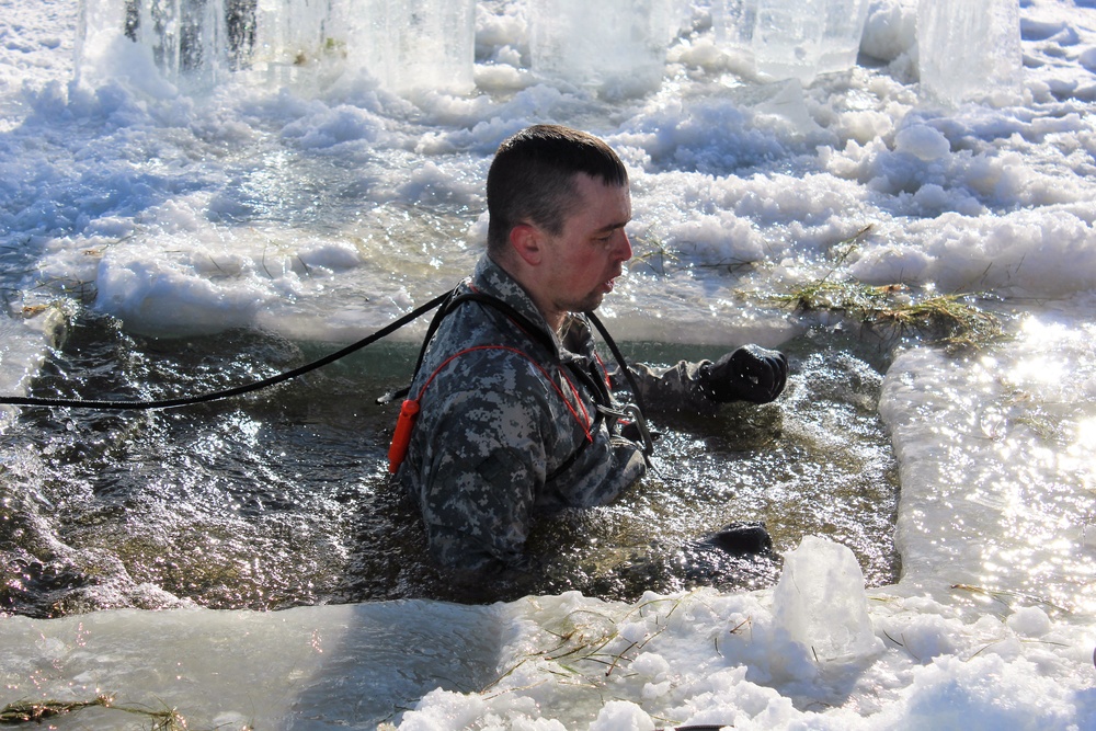 Students take plunge in icy water for Cold-Weather Operations Course 18-02 at Fort McCoy