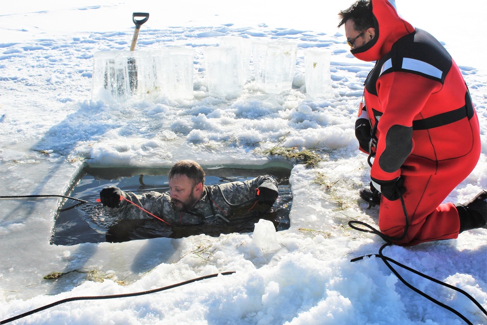 Students take plunge in icy water for Cold-Weather Operations Course 18-02 at Fort McCoy