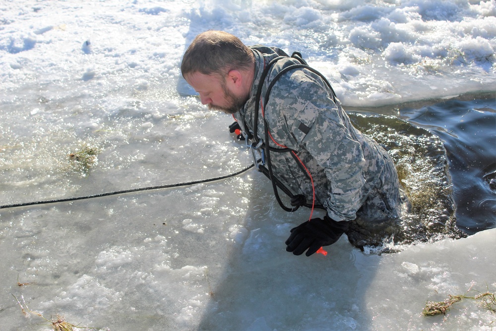 Students take plunge in icy water for Cold-Weather Operations Course 18-02 at Fort McCoy