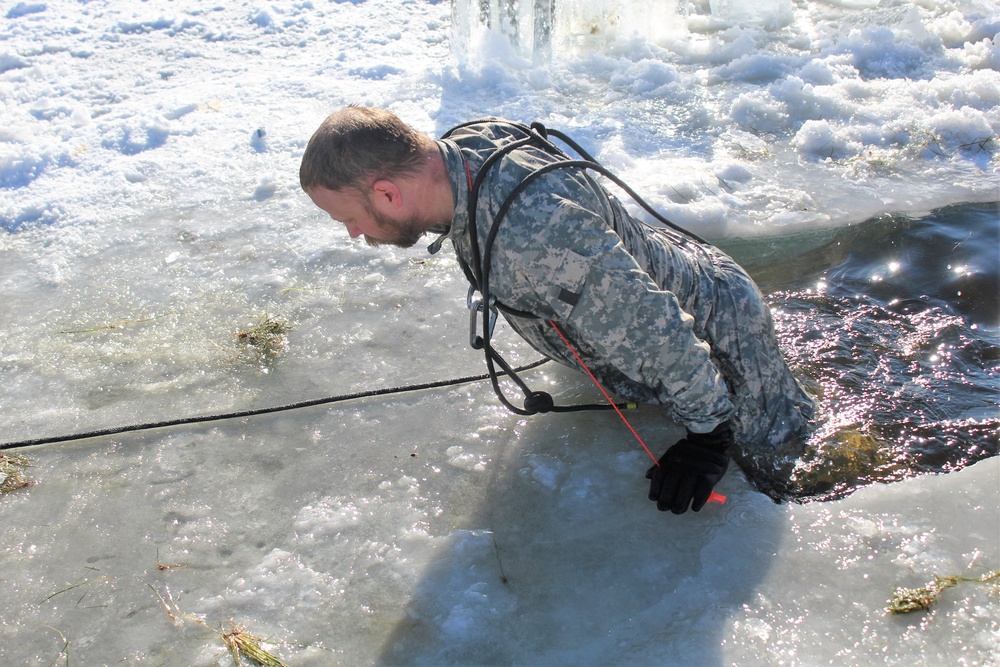 Students take plunge in icy water for Cold-Weather Operations Course 18-02 at Fort McCoy