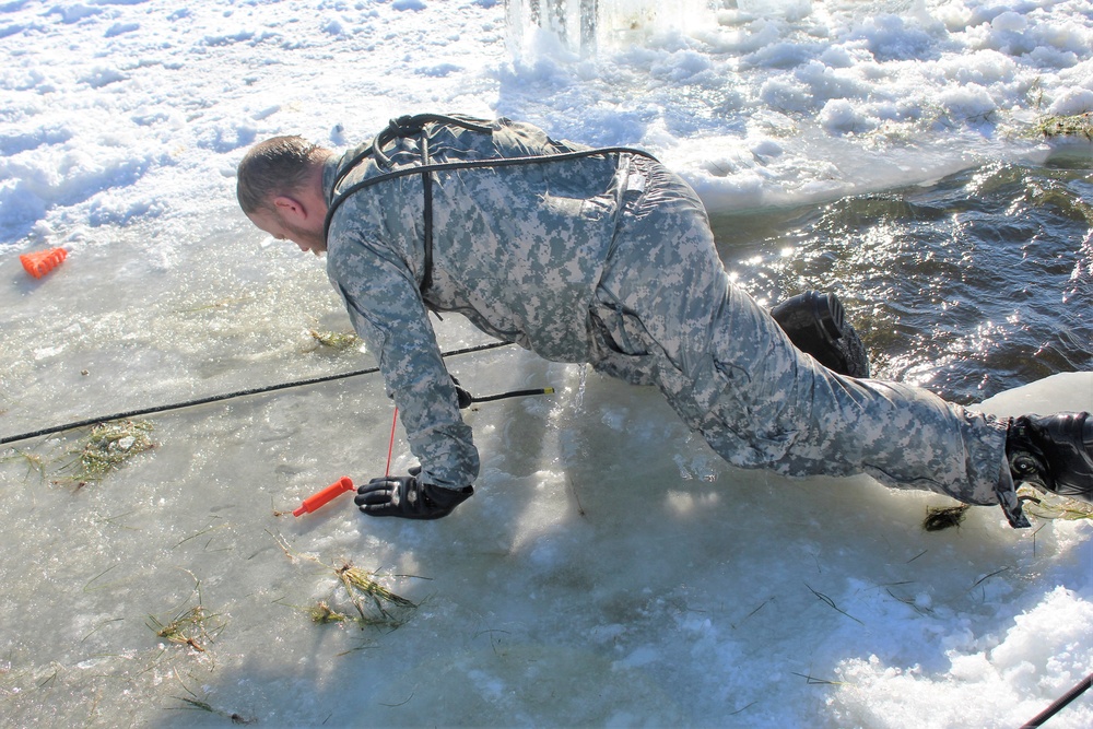 Students take plunge in icy water for Cold-Weather Operations Course 18-02 at Fort McCoy