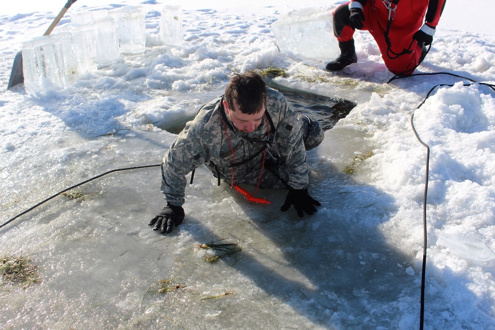 Students take plunge in icy water for Cold-Weather Operations Course 18-02 at Fort McCoy