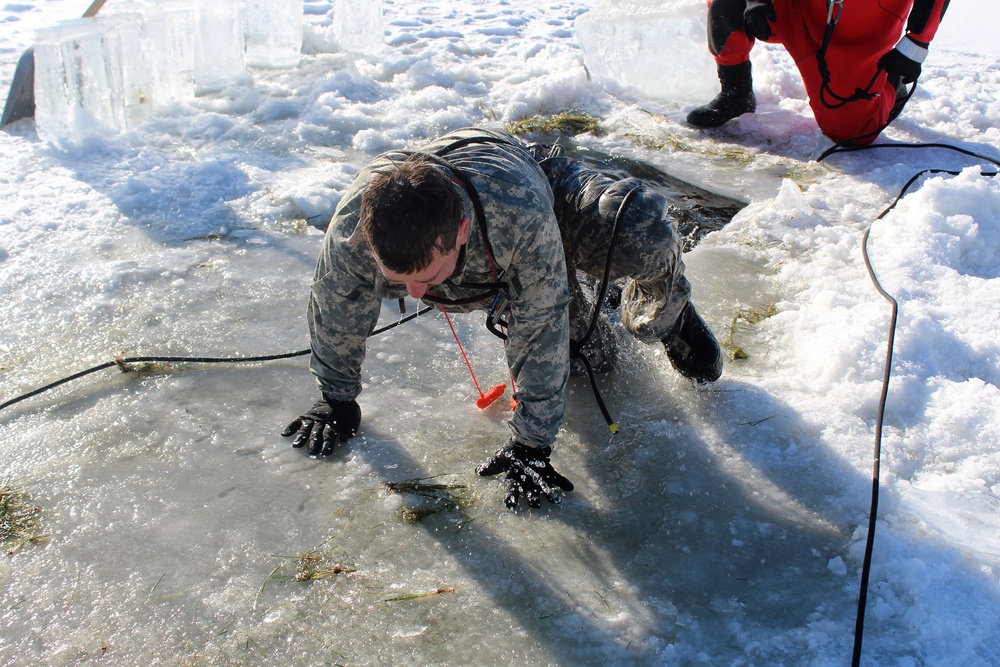 Students take plunge in icy water for Cold-Weather Operations Course 18-02 at Fort McCoy