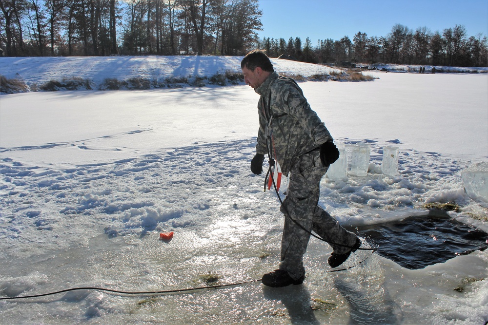 Students take plunge in icy water for Cold-Weather Operations Course 18-02 at Fort McCoy