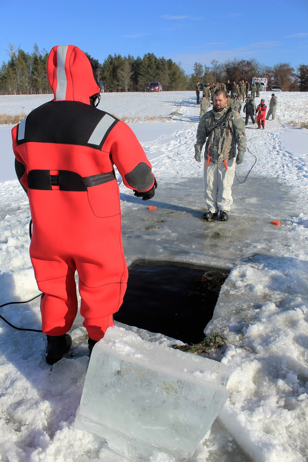 Students take plunge in icy water for Cold-Weather Operations Course 18-02 at Fort McCoy