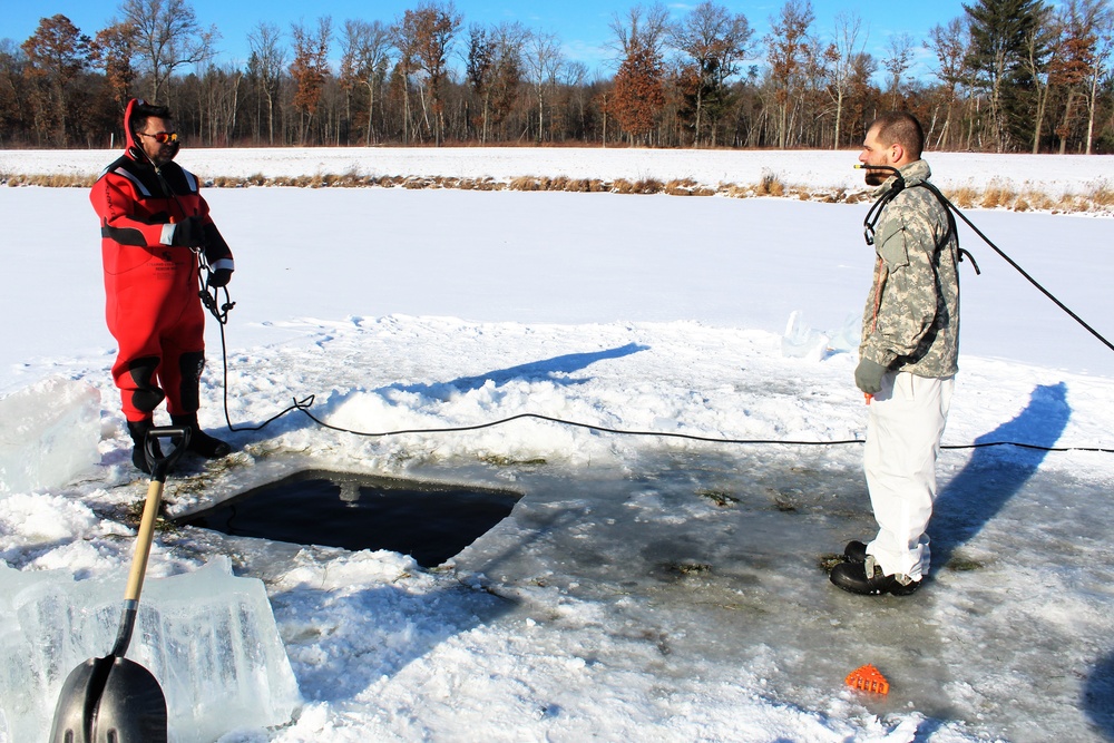 Students take plunge in icy water for Cold-Weather Operations Course 18-02 at Fort McCoy