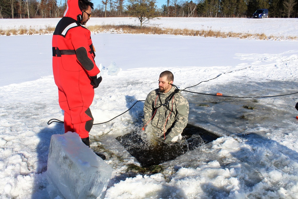 Students take plunge in icy water for Cold-Weather Operations Course 18-02 at Fort McCoy