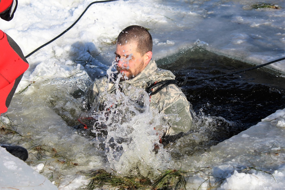 Students take plunge in icy water for Cold-Weather Operations Course 18-02 at Fort McCoy