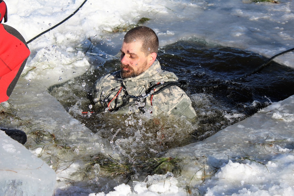 Students take plunge in icy water for Cold-Weather Operations Course 18-02 at Fort McCoy