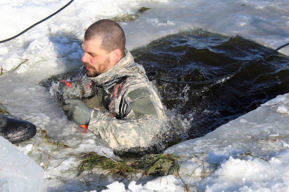 Students take plunge in icy water for Cold-Weather Operations Course 18-02 at Fort McCoy