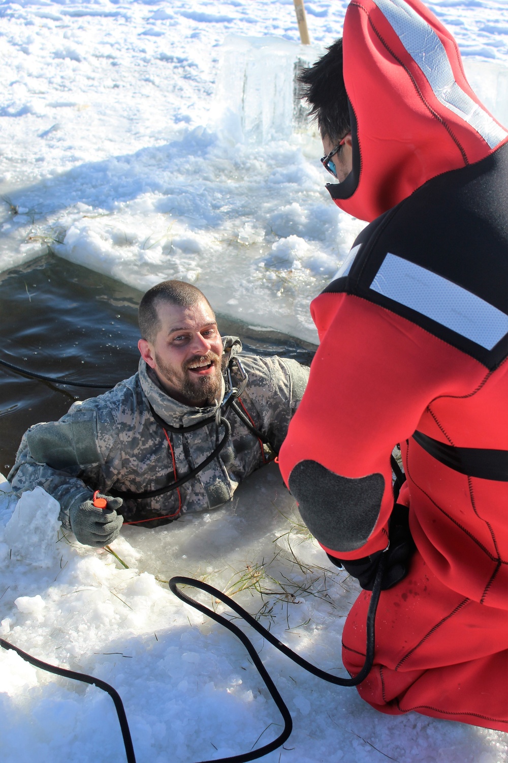 Students take plunge in icy water for Cold-Weather Operations Course 18-02 at Fort McCoy
