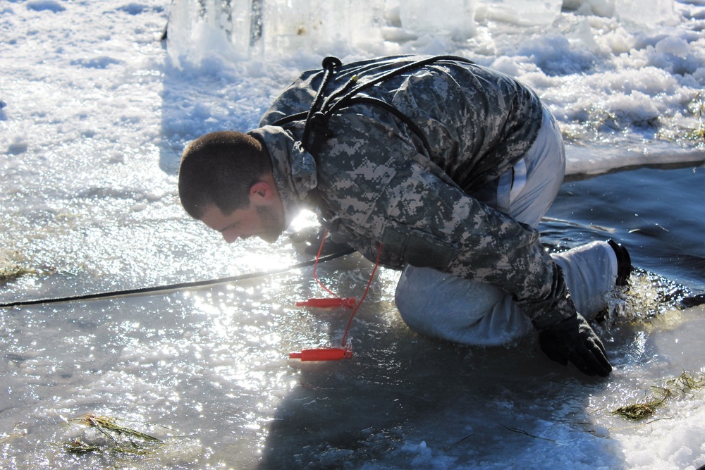 Students take plunge in icy water for Cold-Weather Operations Course 18-02 at Fort McCoy