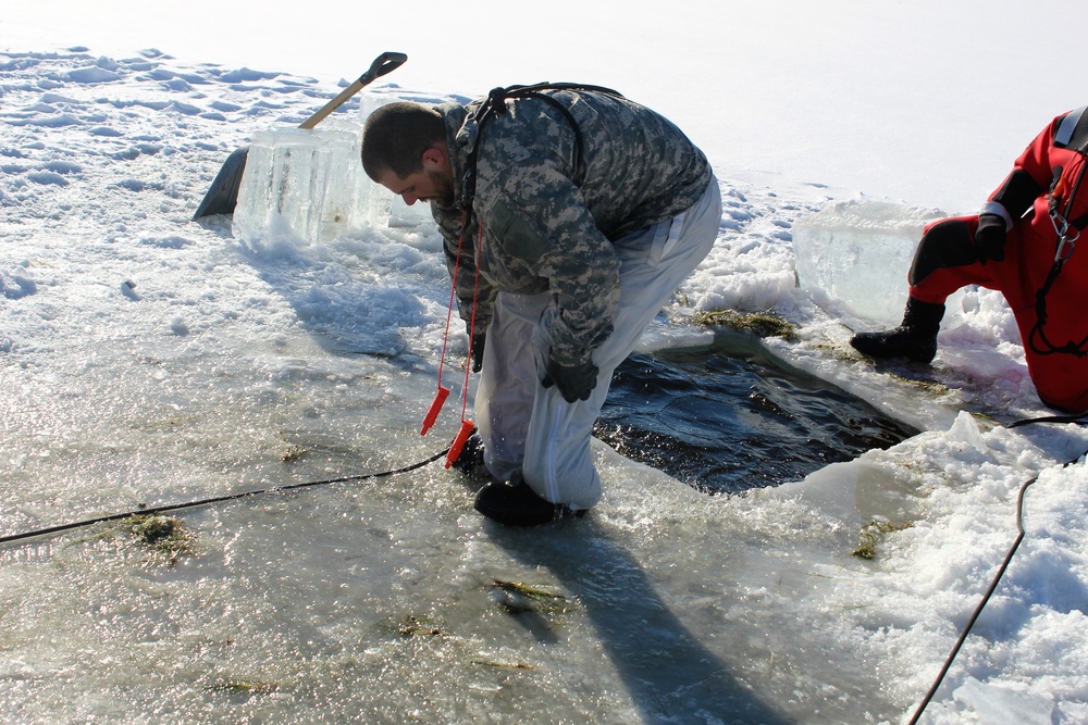 Students take plunge in icy water for Cold-Weather Operations Course 18-02 at Fort McCoy