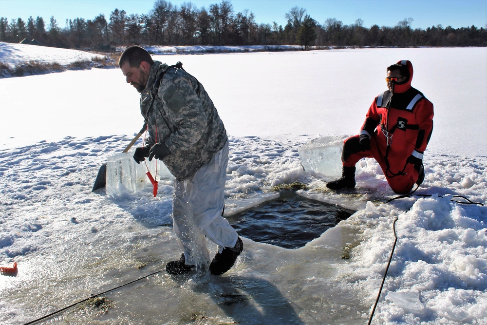 Students take plunge in icy water for Cold-Weather Operations Course 18-02 at Fort McCoy