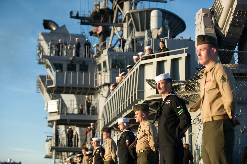 USS America mans the rails during their return to homeport