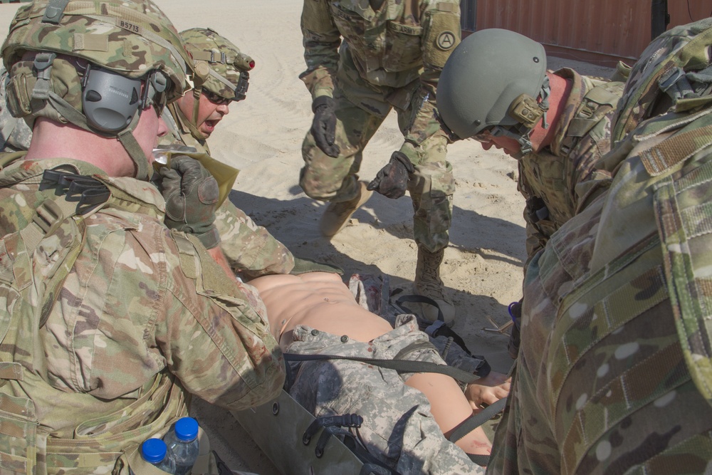 Soldiers assess simulated casualty for training