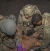 Soldiers assess simulated casualty for training