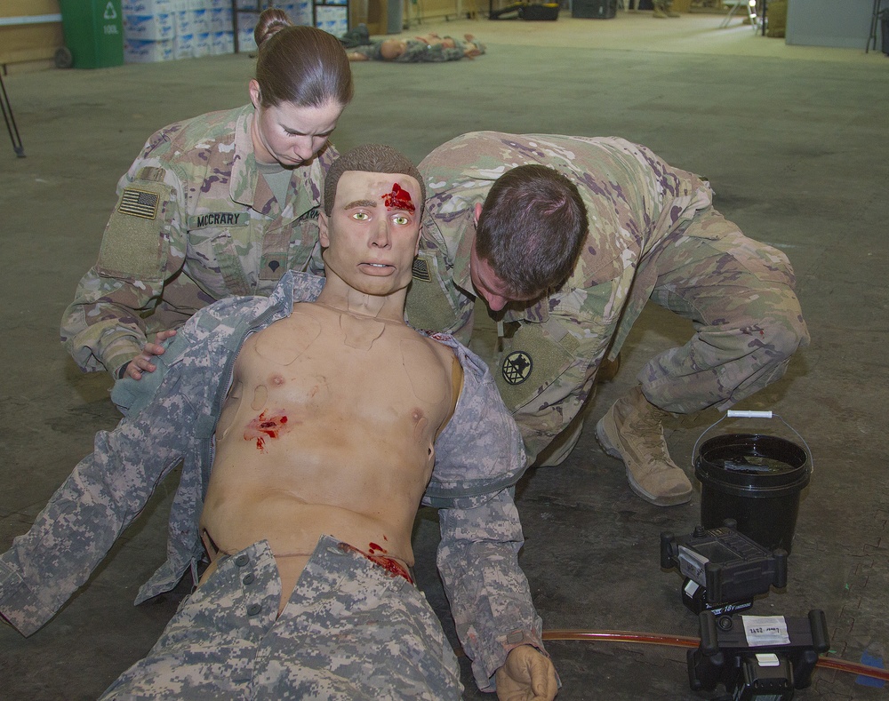 Soldiers prepare mannequin for training