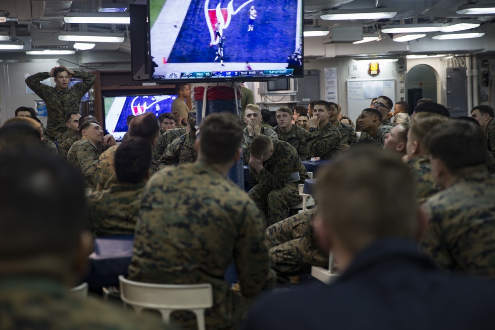 Sailors and Marines enjoy Super Bowl while deployed
